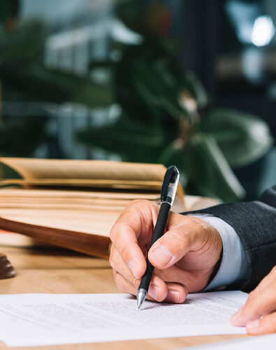 a man signing a contract.